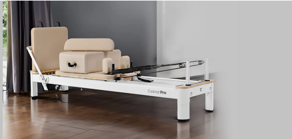 Contour Pro Aluminium beige Pilates reformer in a dedicated workout space