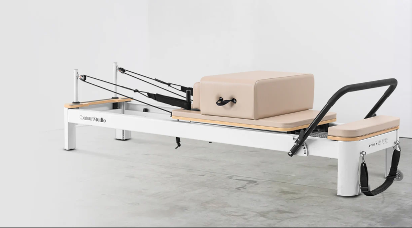 Contour Studio Commercial beige Pilates reformer with aluminium frame and Pilates box